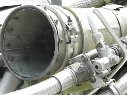Close-up of mechanical parts and pipes in a wastewater treatment plant.