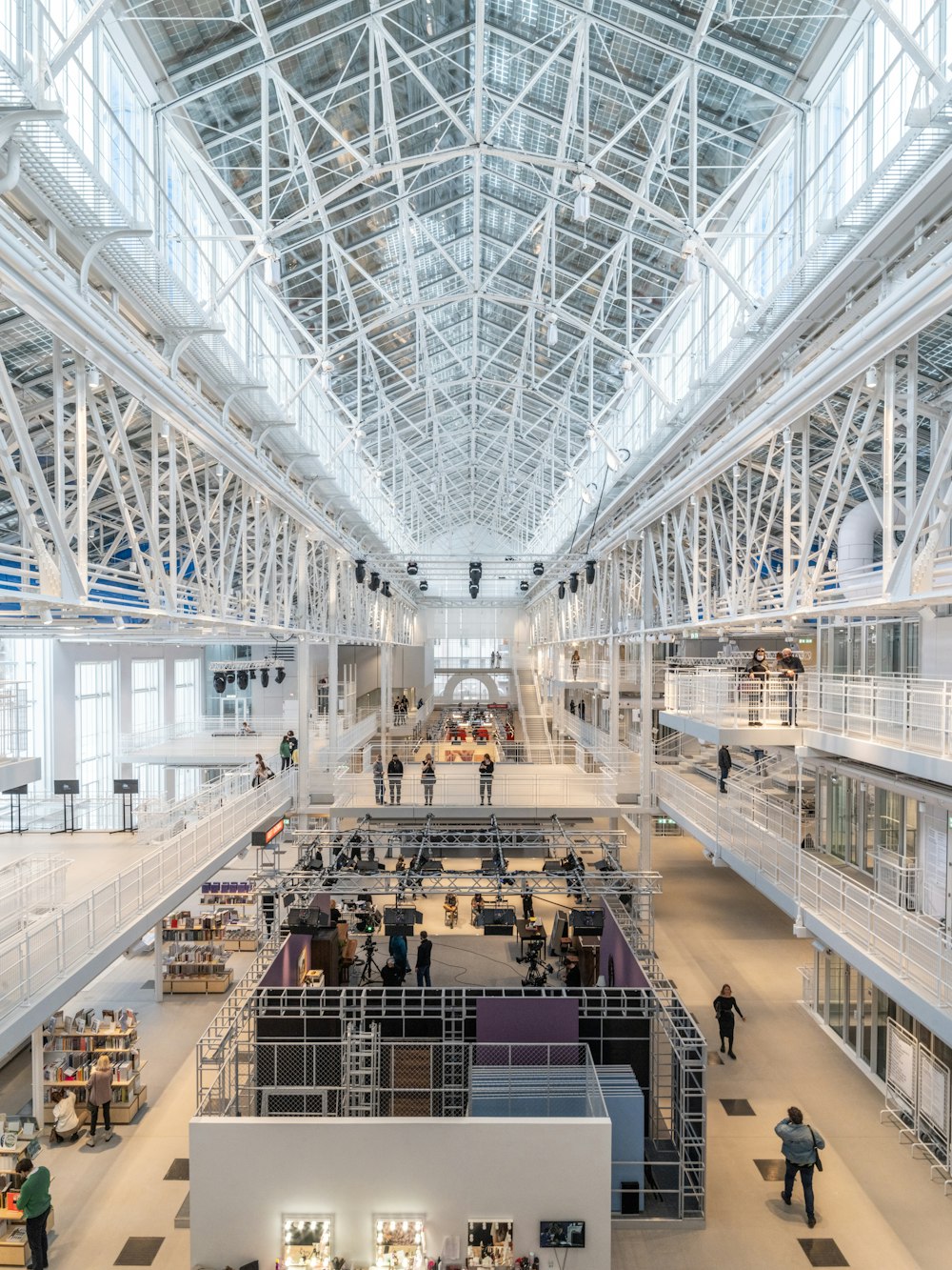 a group of people standing inside of a building