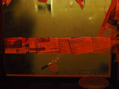 Rows of political pamphlets drying on racks inside the print shop.