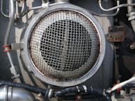 Technician using specialized equipment to clean return grills.