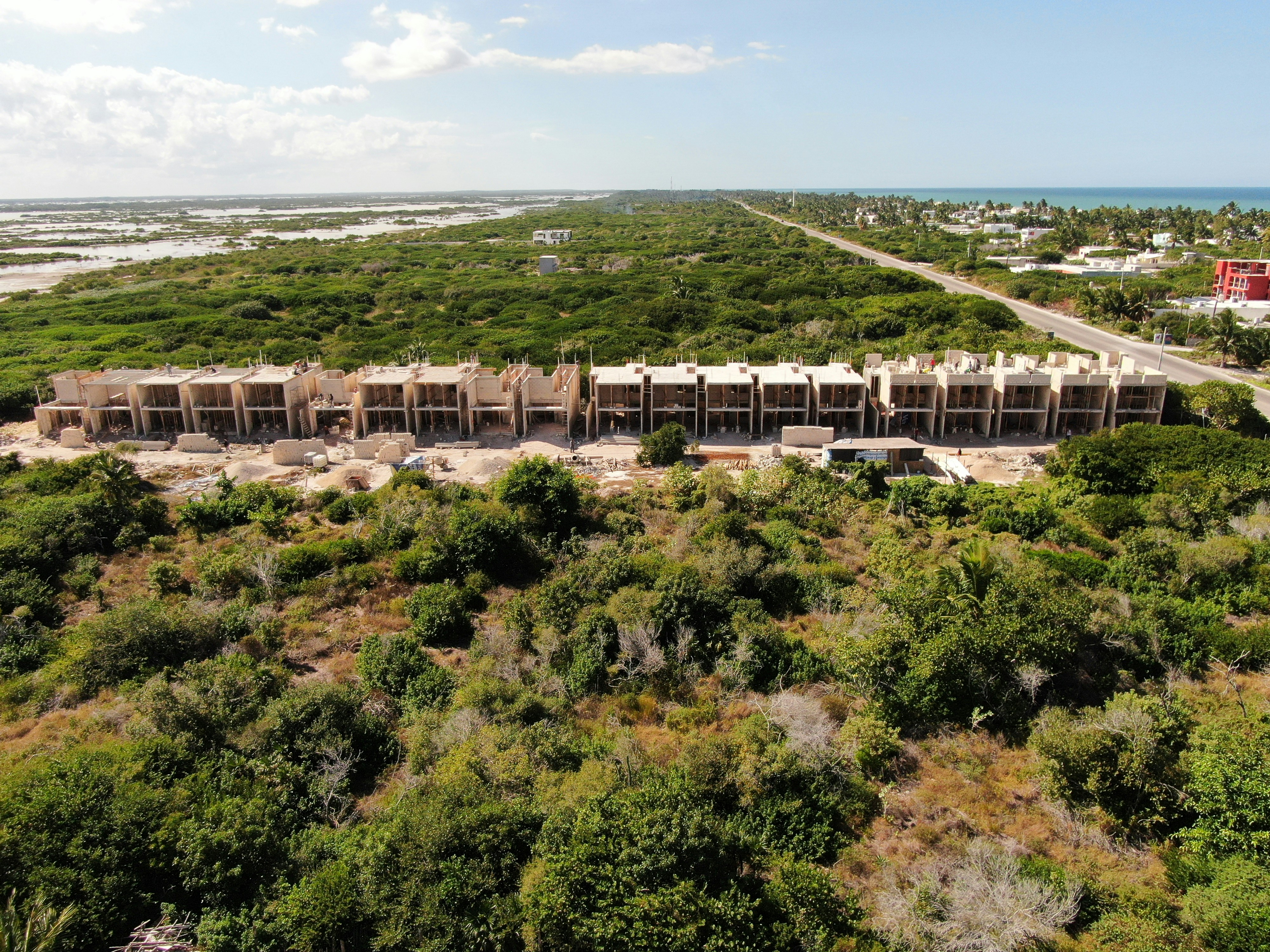 an aerial view of a large building in the middle of trees