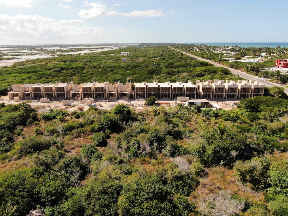 an aerial view of a large building in the middle of trees