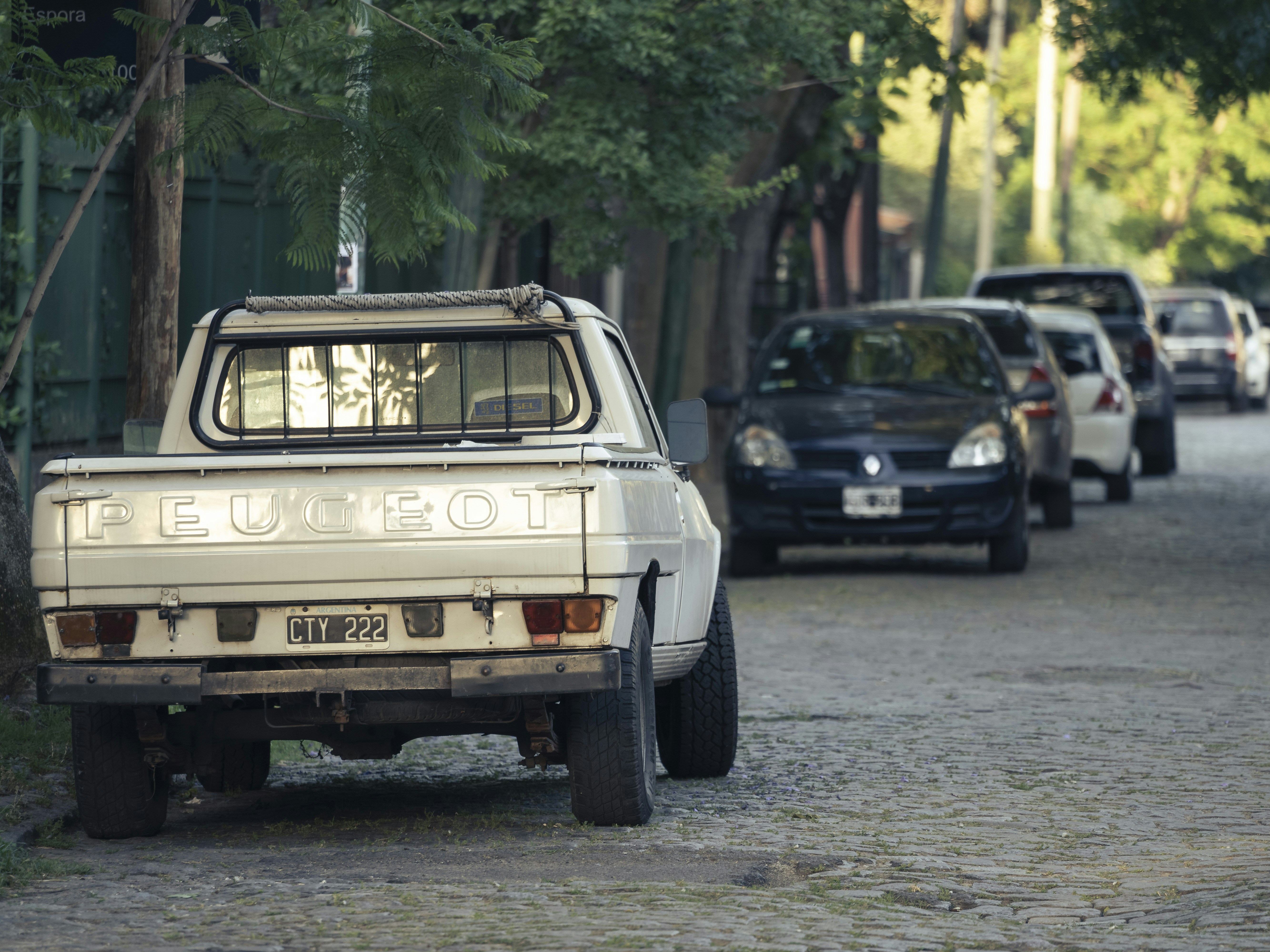 A white truck parked on the side of a road photo – Free Car Image on ...