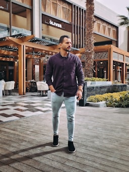 a man standing in front of a building
