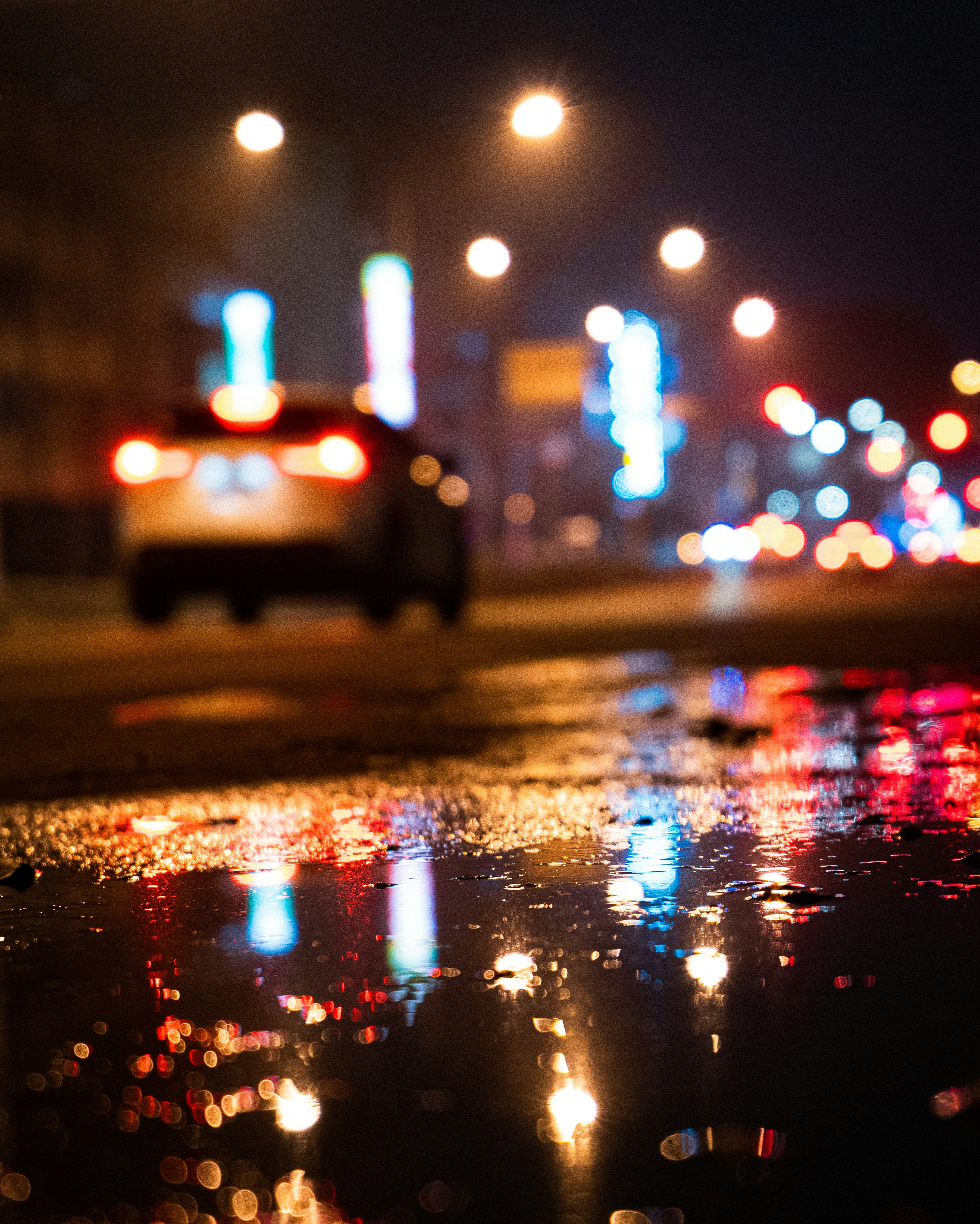 rainy car, wet pavement, urban night, reflective asphalt, ilustrasi artikel  Moody Rain and Wet Asphalt Car Backgrounds: Capturing the Essence of Urban Aesthetics 6