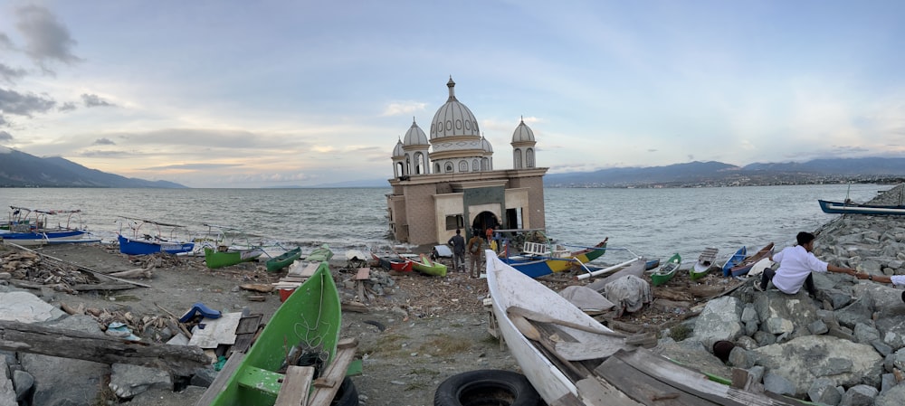 a couple of boats sitting on top of a beach