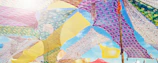 Colorful Olefin awning fabric stretched over a modern outdoor shade structure