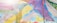 A canopy of vibrantly colored fabric panels stretches across the sky, featuring a variety of patterns including zigzags, florals, and abstract designs. Sunlight filters through the fabric, creating a bright and festive atmosphere.