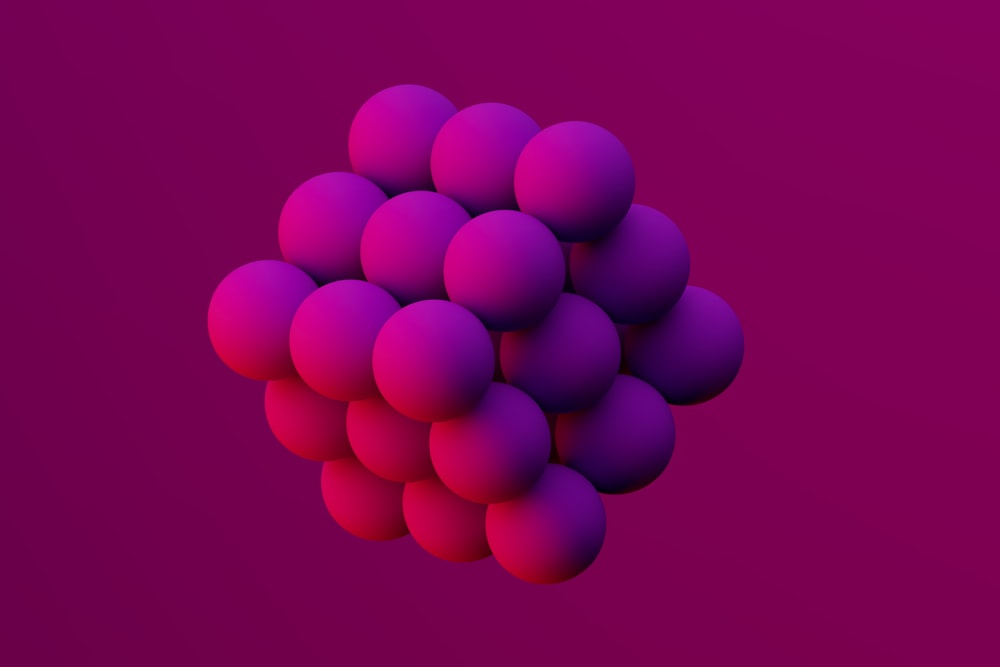 a bunch of balls on a purple background