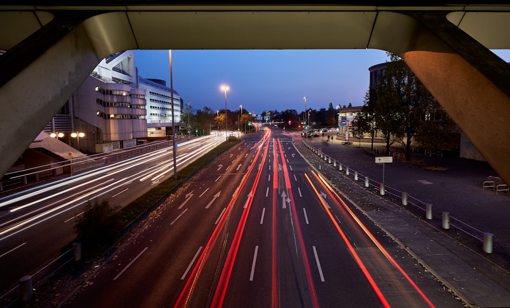 a city street filled with lots of traffic at night