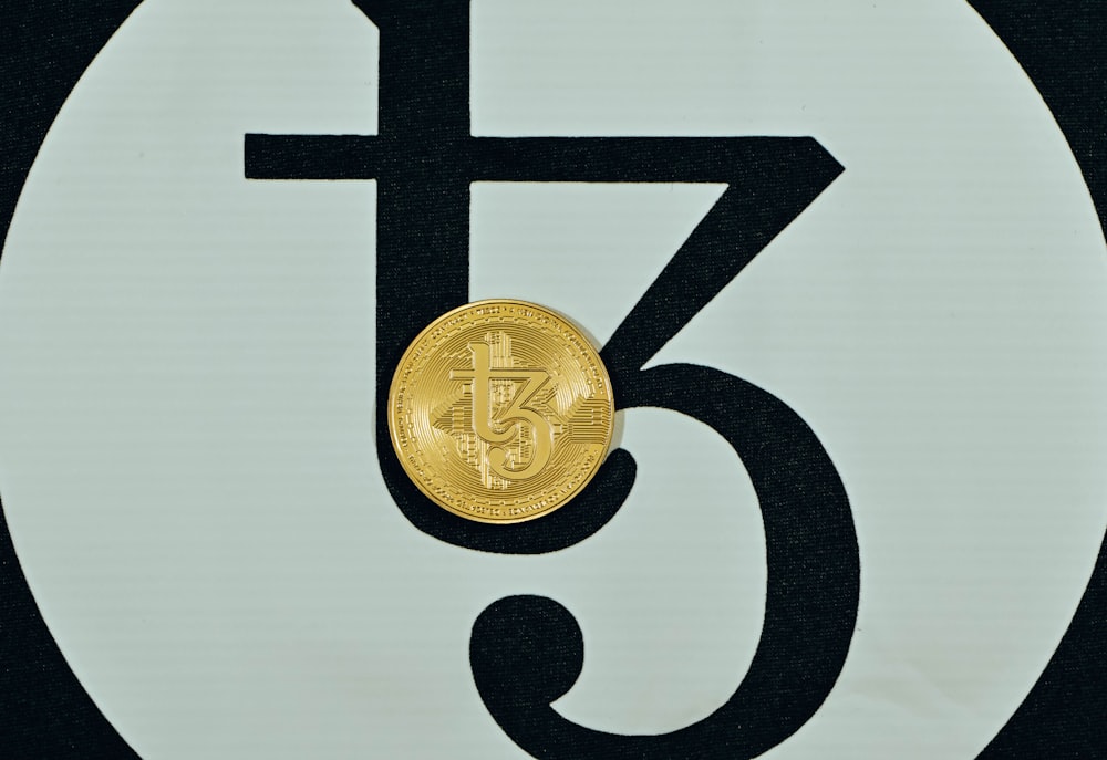 a close up of a coin on a sign