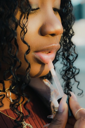 a close up of a person holding a toothbrush