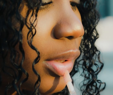 a close up of a person holding a toothbrush