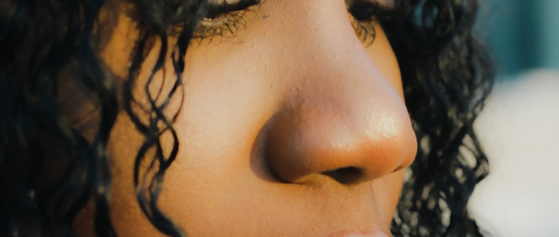 a close up of a person holding a toothbrush