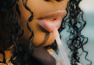 a close up of a person holding a toothbrush