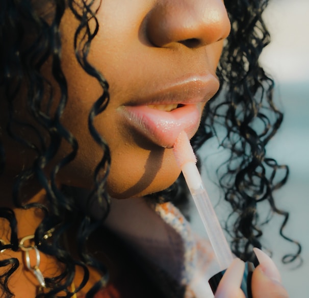 a close up of a person holding a toothbrush