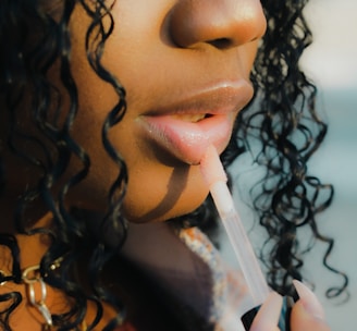 a close up of a person holding a toothbrush