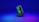 A smartphone displaying green computer code stands upright on a round, dark platform. The background fades from deep blue at the top to purple at the bottom, creating a futuristic and digital ambiance.