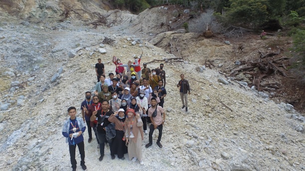 A group of photographers smiling together at a scenic outdoor location in El Salvador.