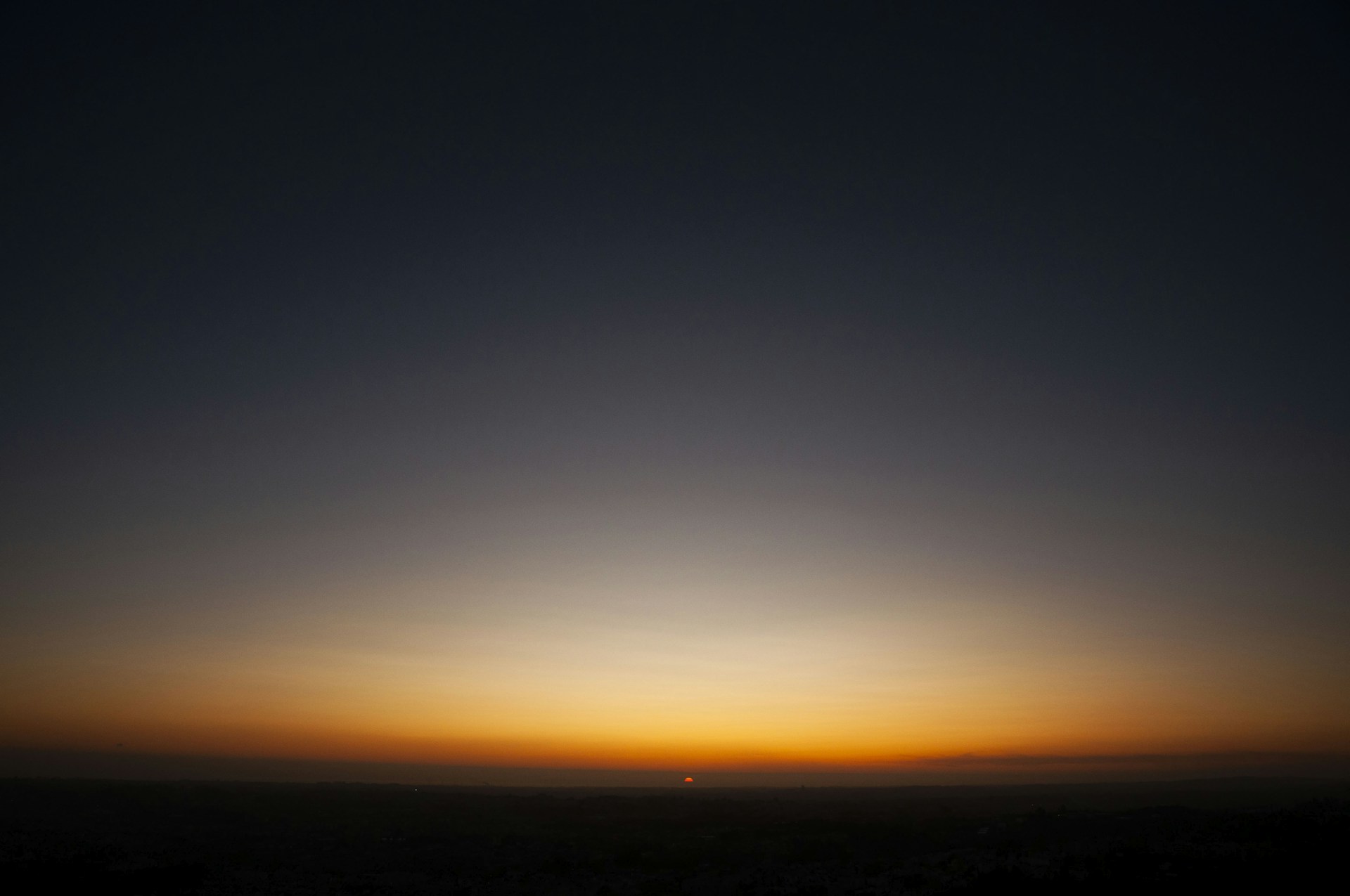 the sun is setting over the horizon of the horizon