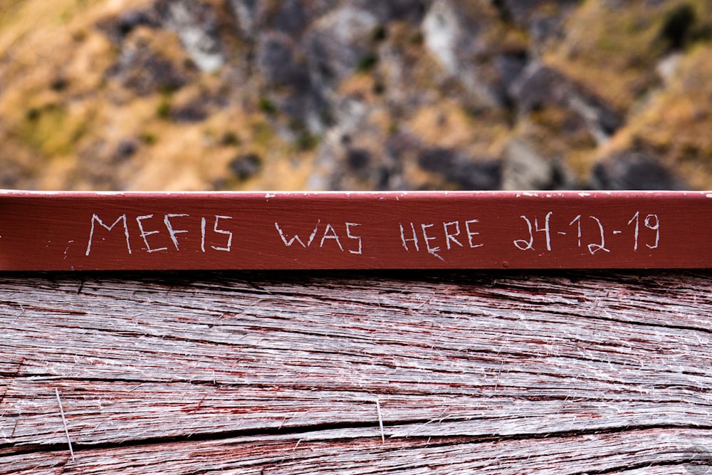 a wooden sign that says merfs was here on it
