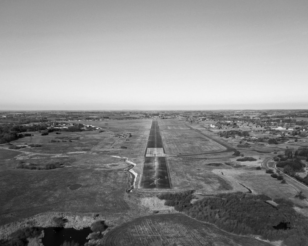 a black and white photo of an airport runway