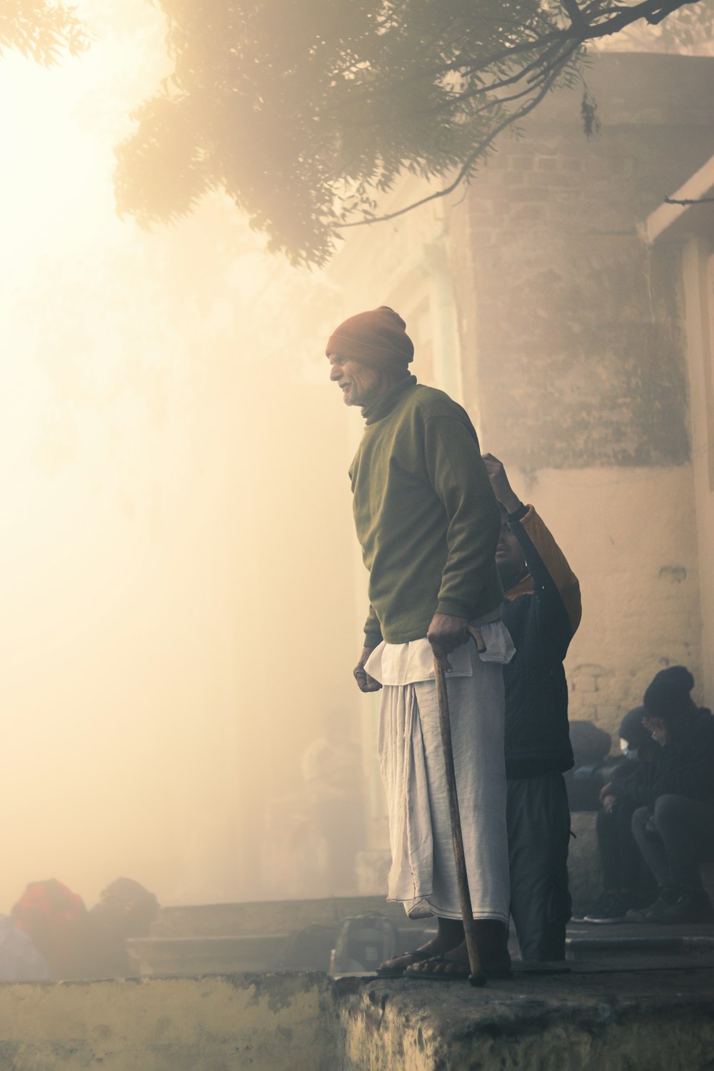 a man standing on top of a stone step