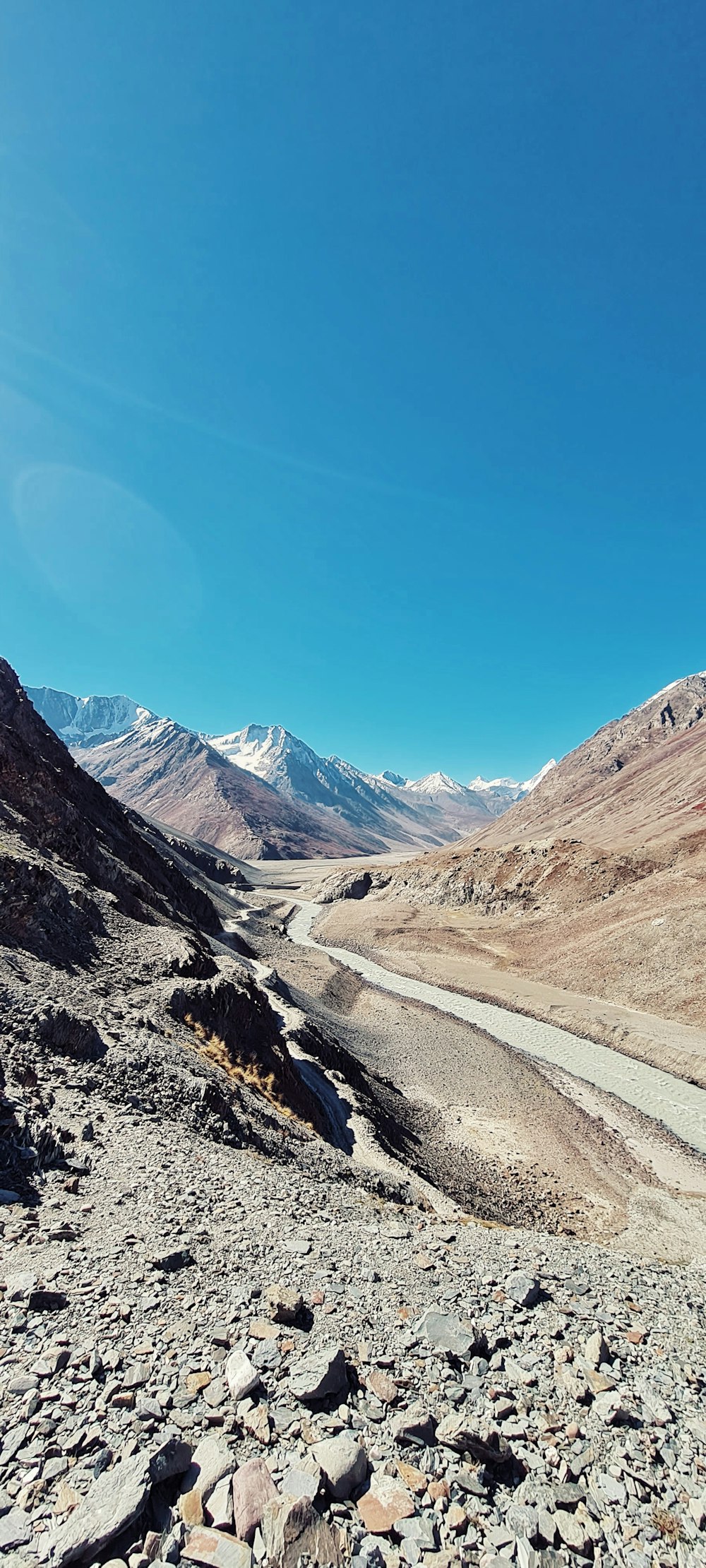 a view of a road in the middle of a mountain range