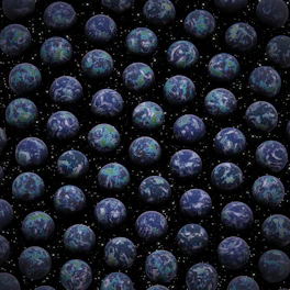 a large group of blue balls in the air