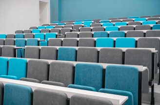 rows of blue and grey chairs in a room