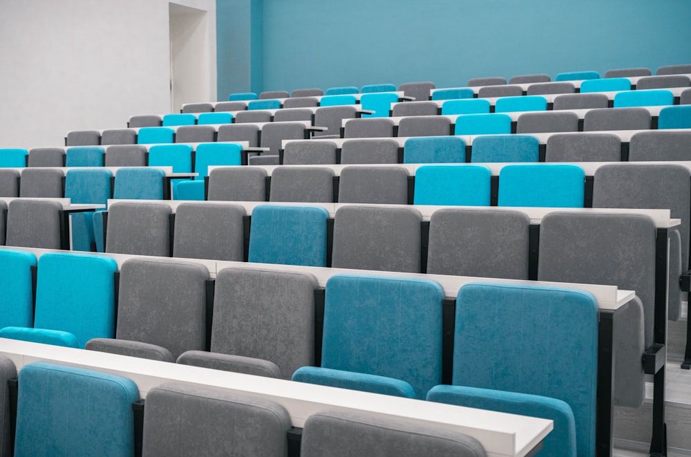 rows of blue and grey chairs in a room