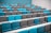 rows of blue and grey chairs in a room