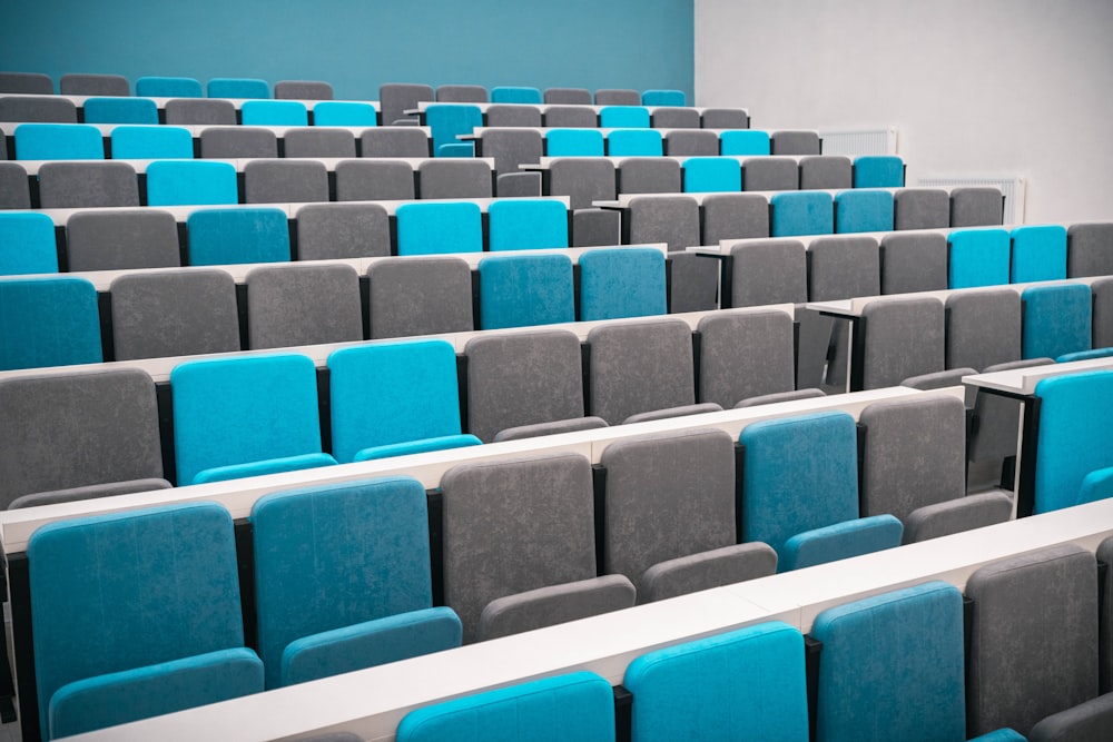 rows of blue and grey chairs in a room