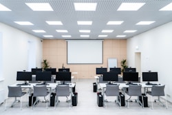 a room filled with lots of desks and computers