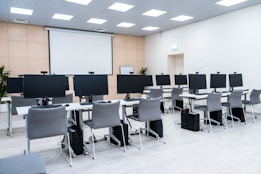 a room filled with lots of computer monitors