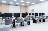 a room filled with lots of computer monitors
