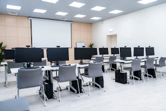 a room filled with lots of computer monitors
