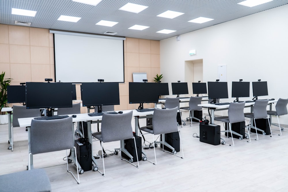 a room filled with lots of computer monitors