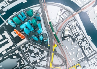 an aerial view of a city with a train station