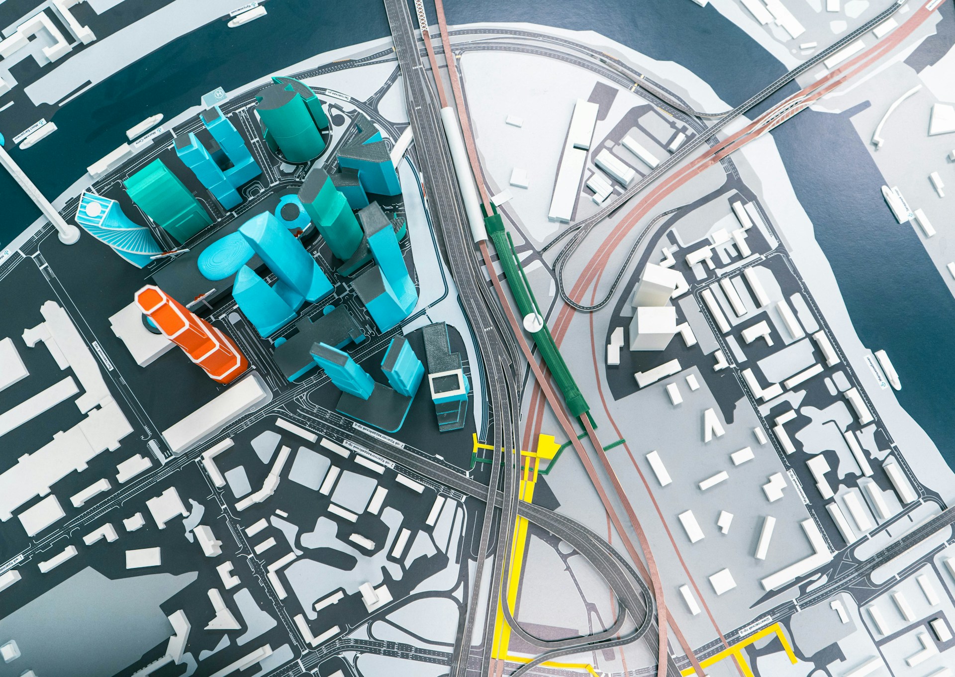 an aerial view of a city with a train station