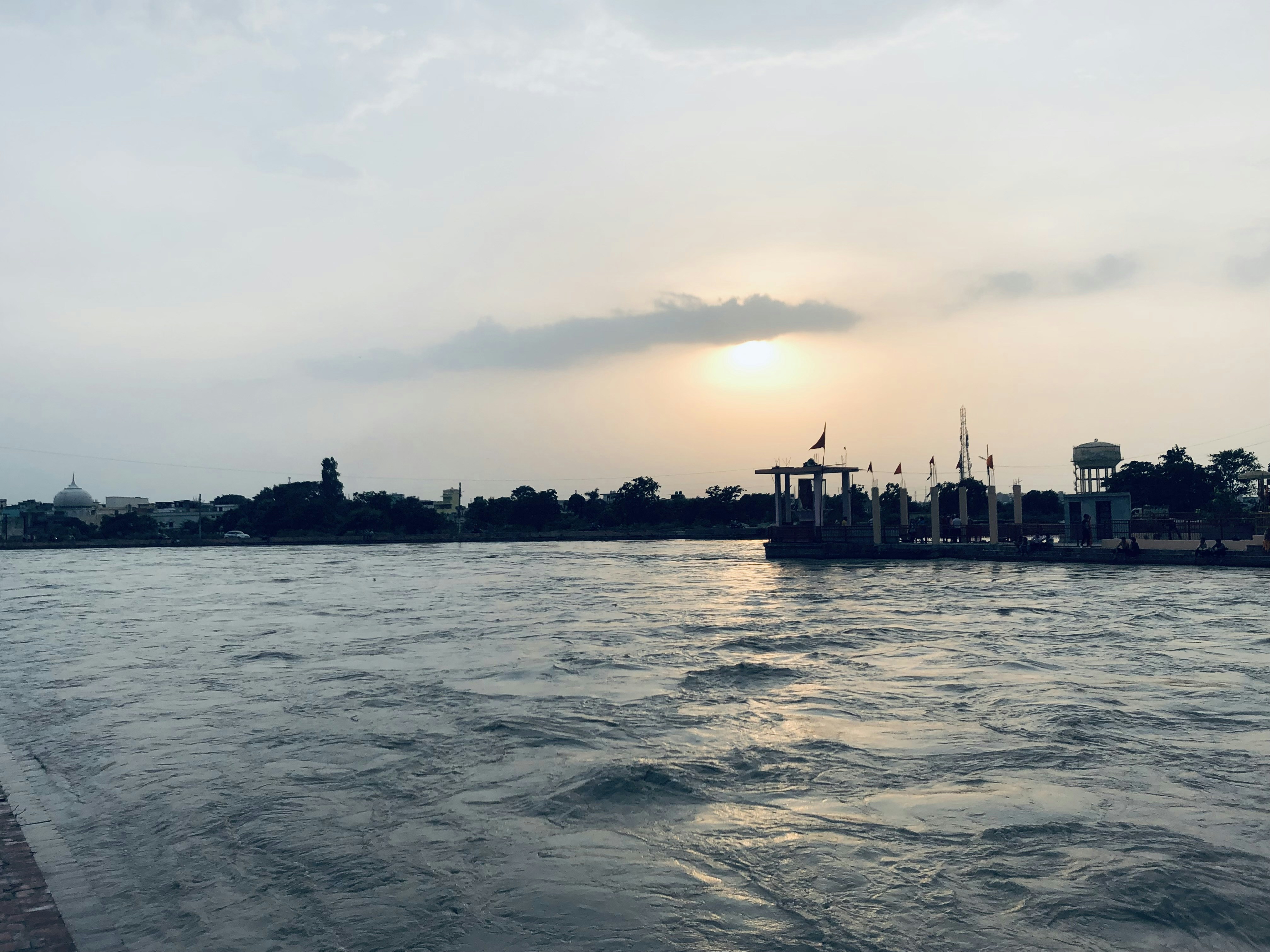 a large body of water with a city in the background
