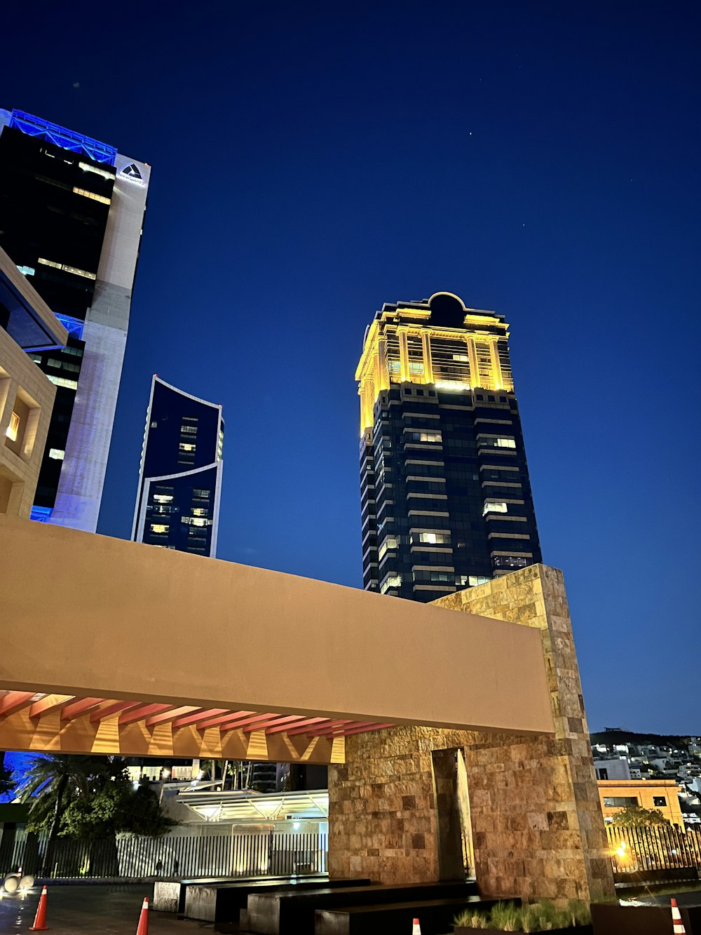 a tall building with a clock tower in the background