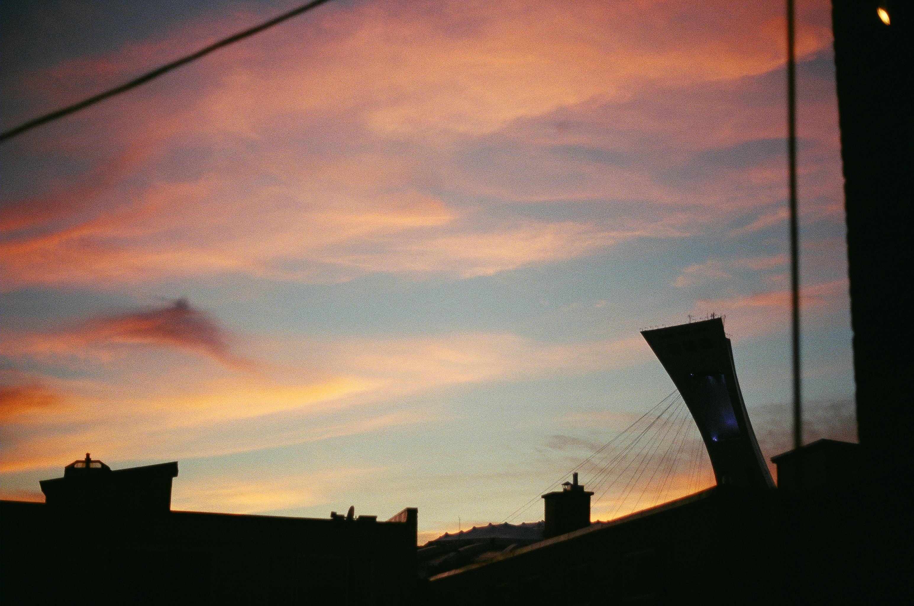 a view of a sunset from a rooftop
