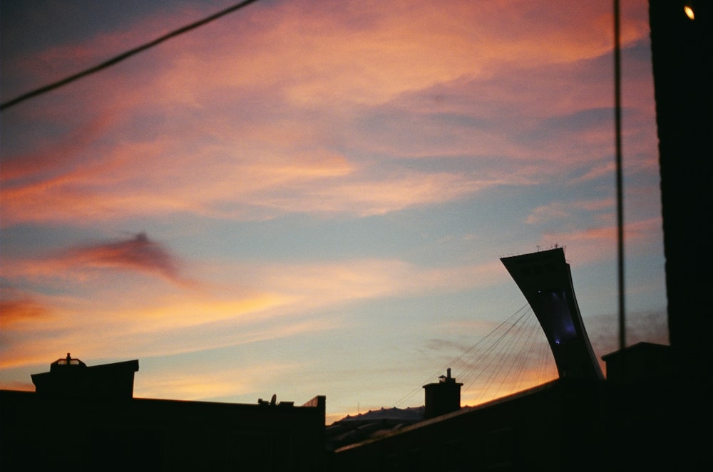 a view of a sunset from a rooftop