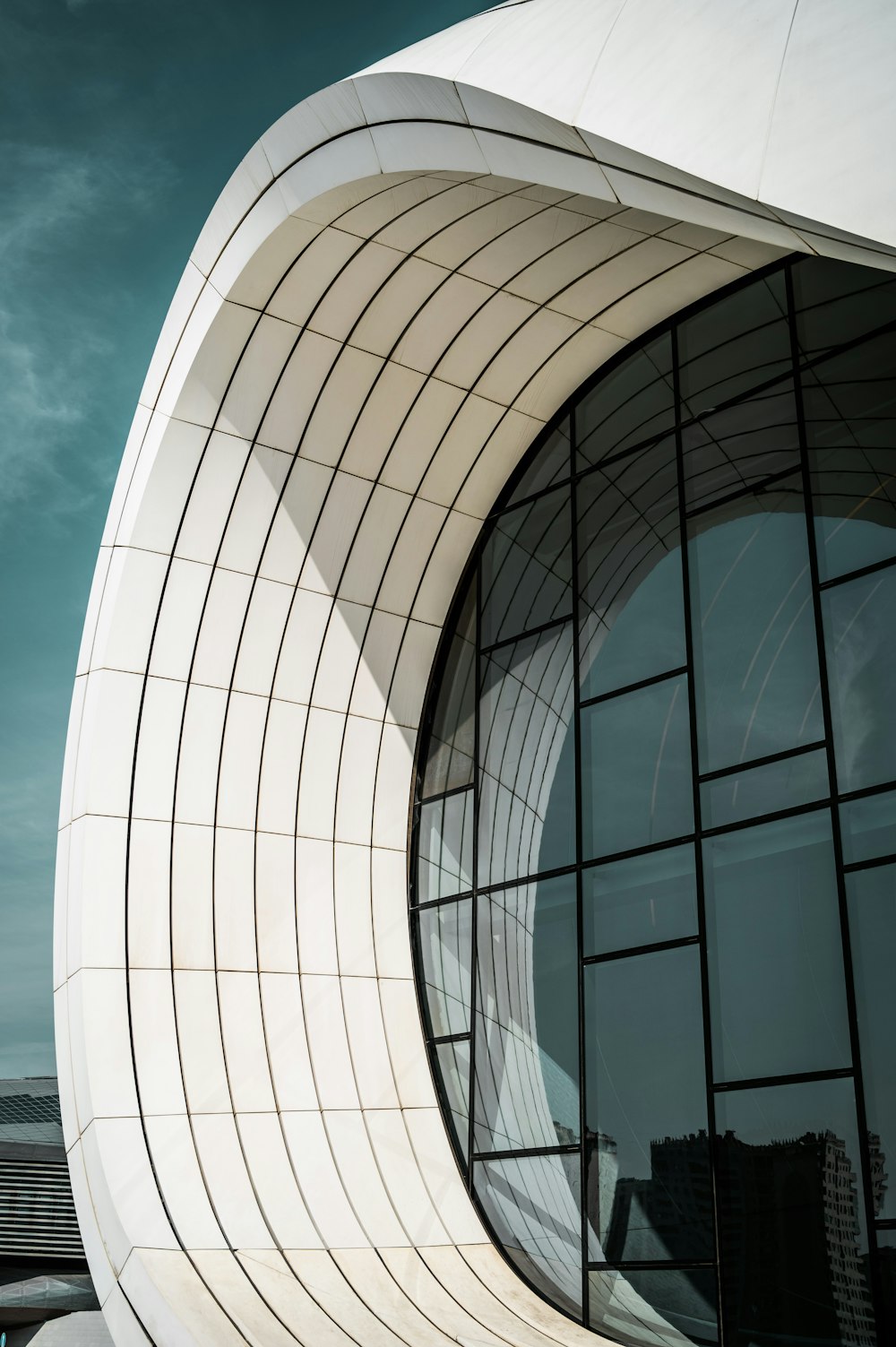 a large white building with a curved window