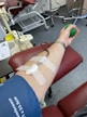Volunteers donating blood in a well-organized community blood drive event.