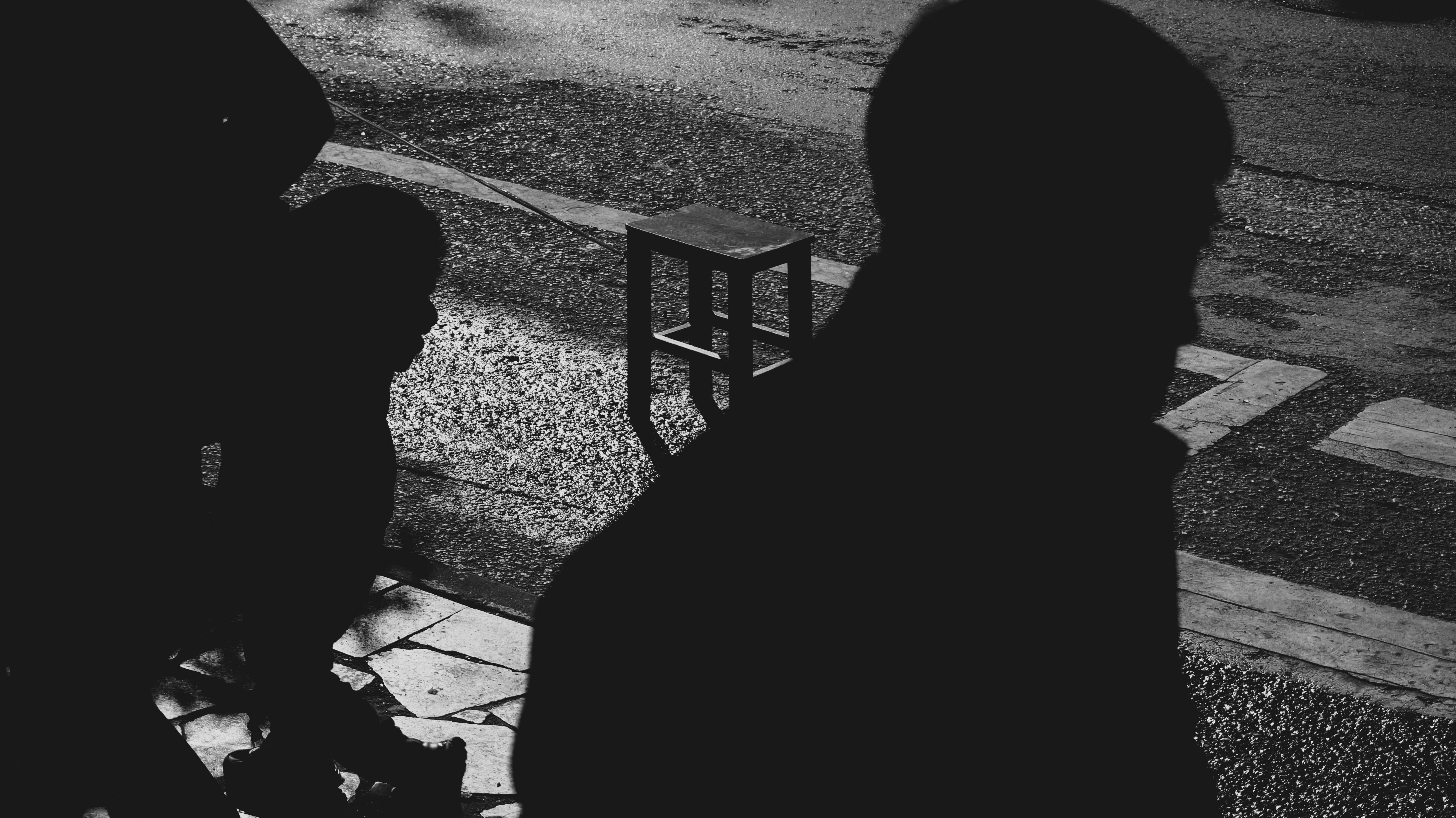 A couple sitting at a dining table looking bored and disconnected during their evening meal, illustrating a lack of engaging conversation.