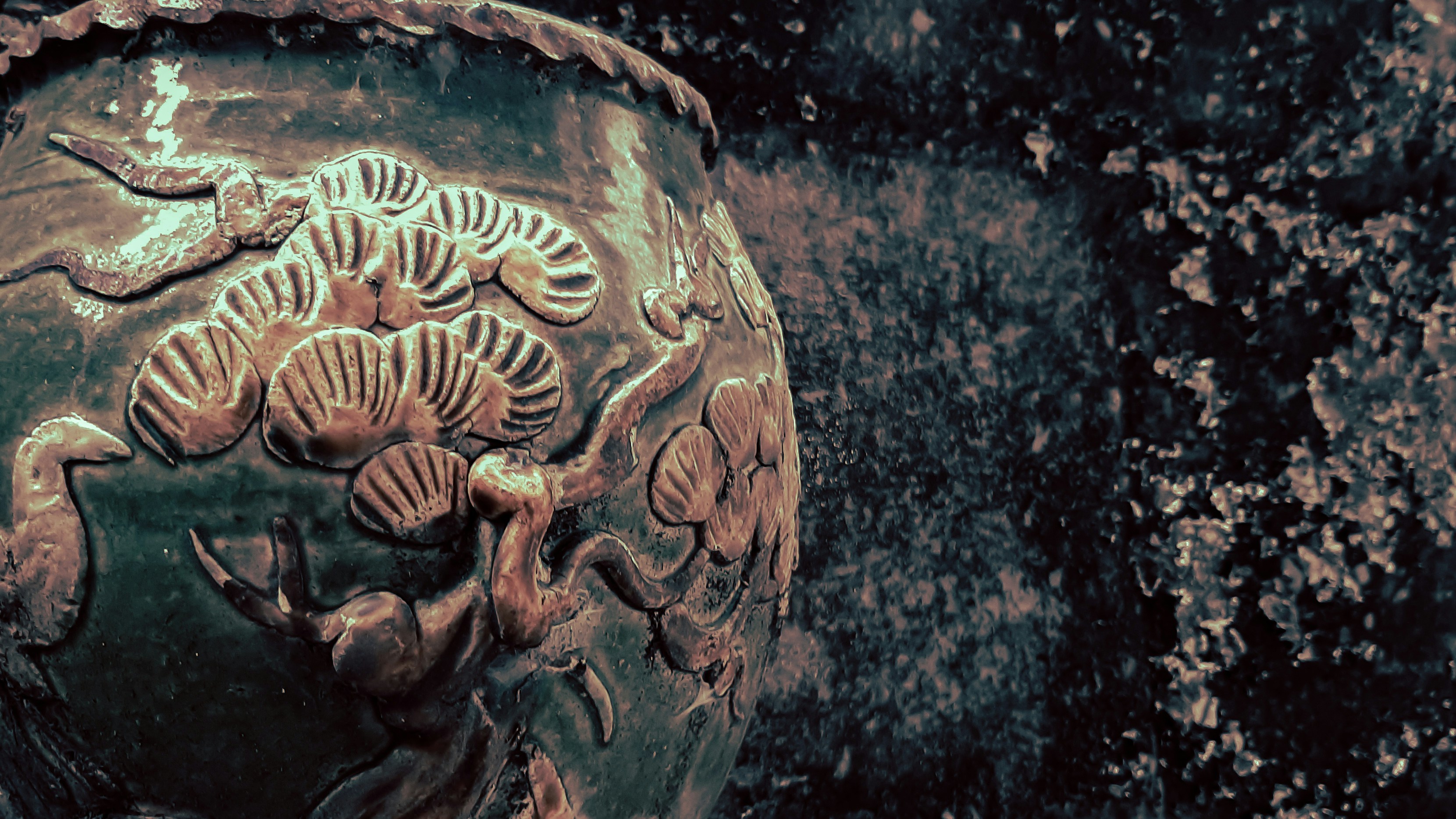 a close up of a vase with designs on it