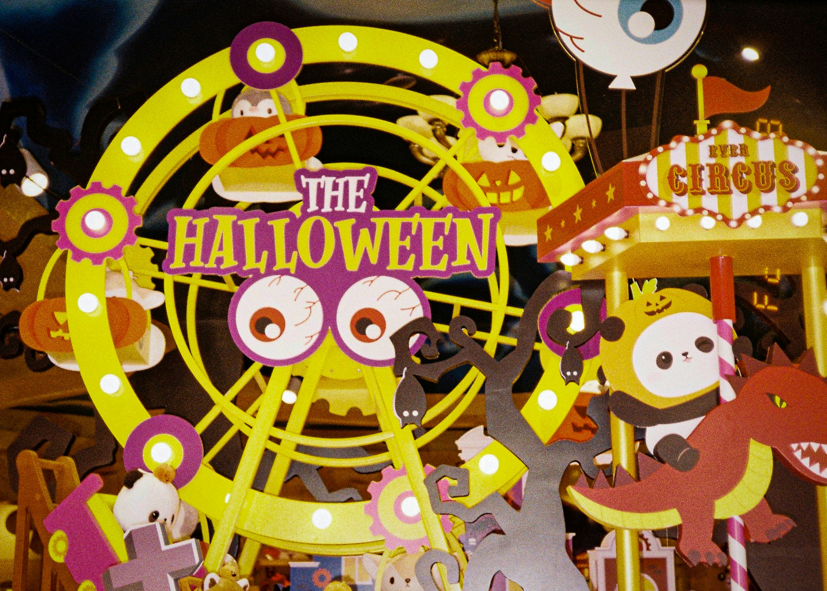 a carnival with a sign that says the halloween fair