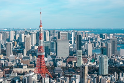a view of a city with a very tall tower